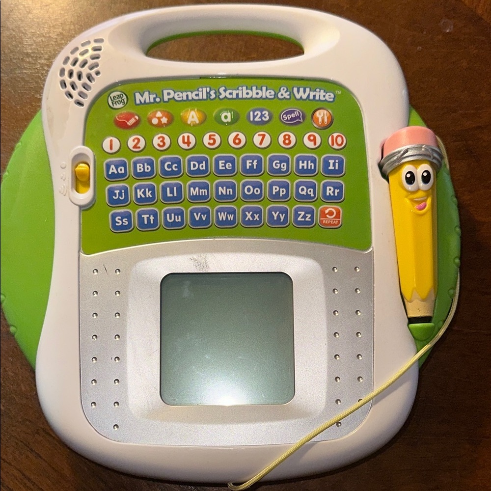 Green and Yellow Learning Toy with Stylus and LCD Screen